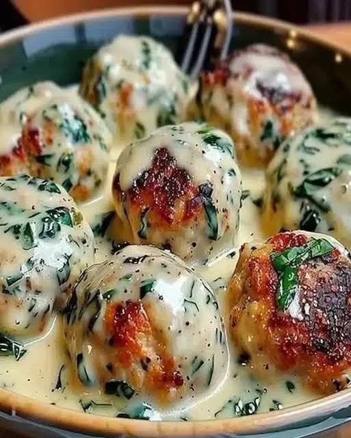 Tender Chicken Ricotta Meatballs in Creamy Spinach Alfredo